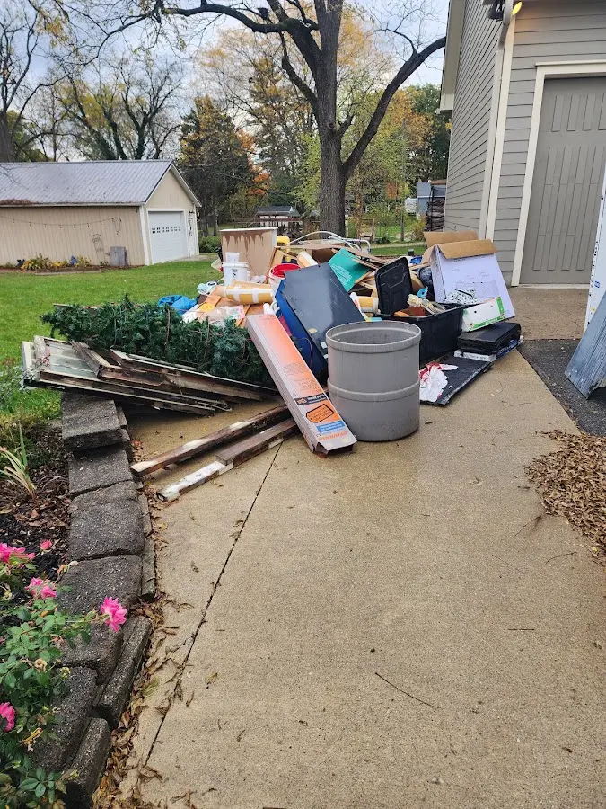 Dumpster being loaded with debris for Commercial Dumpster Rental in Winfield